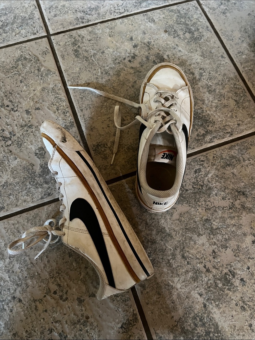 Nike Kids White Sneakers with Black Swoosh and Brown Trim
